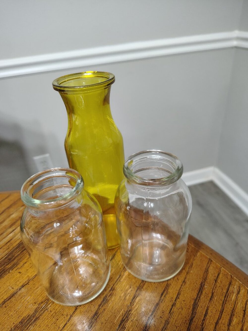 Three emptied and Glass Bottles
